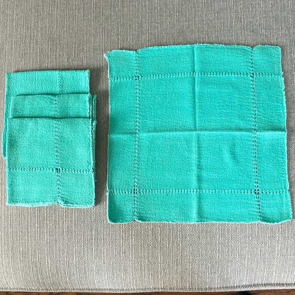 A set of four -3” square cotton napkins. Very soft.